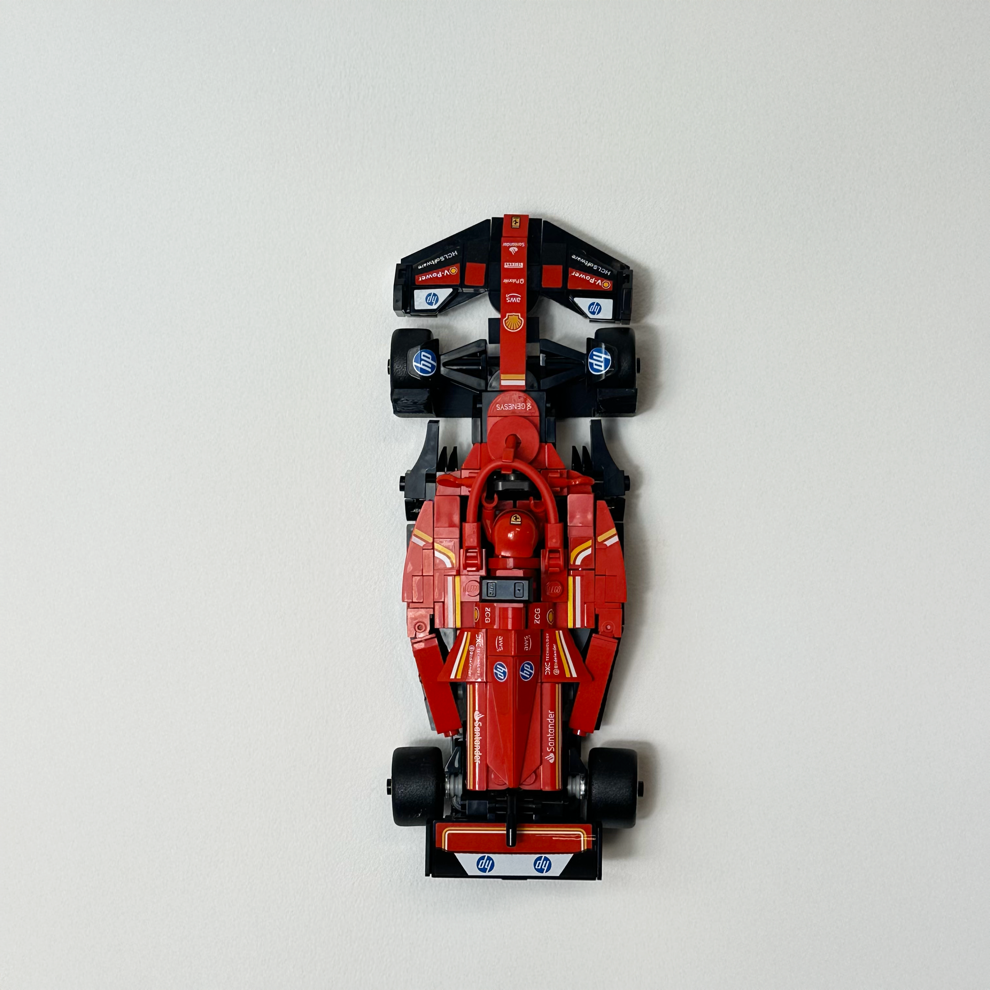 Wall-mounted LEGO Speed Champions models using precision 3D-printed brackets