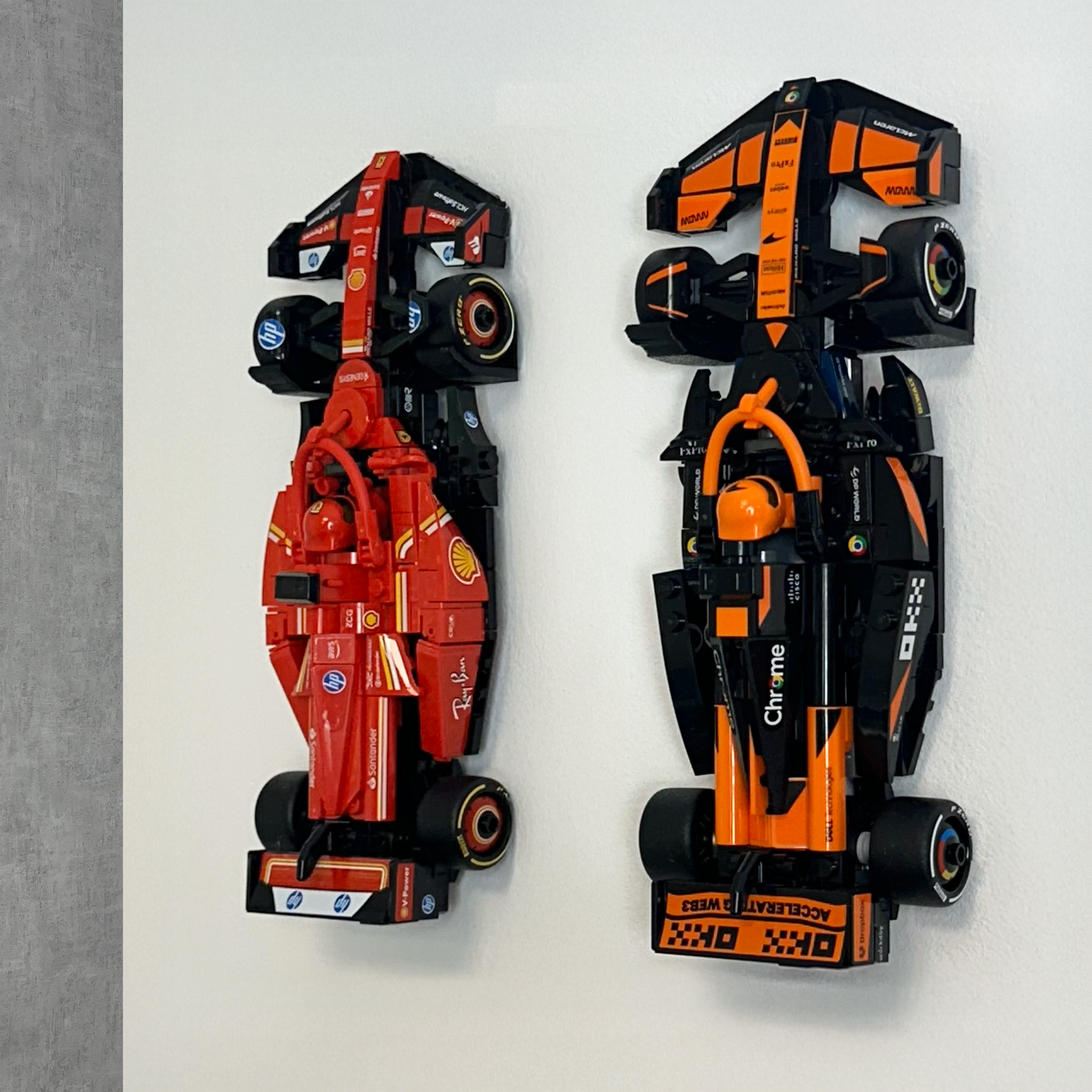 LEGO car mounted on a sleek, black 3D-printed wall display holder