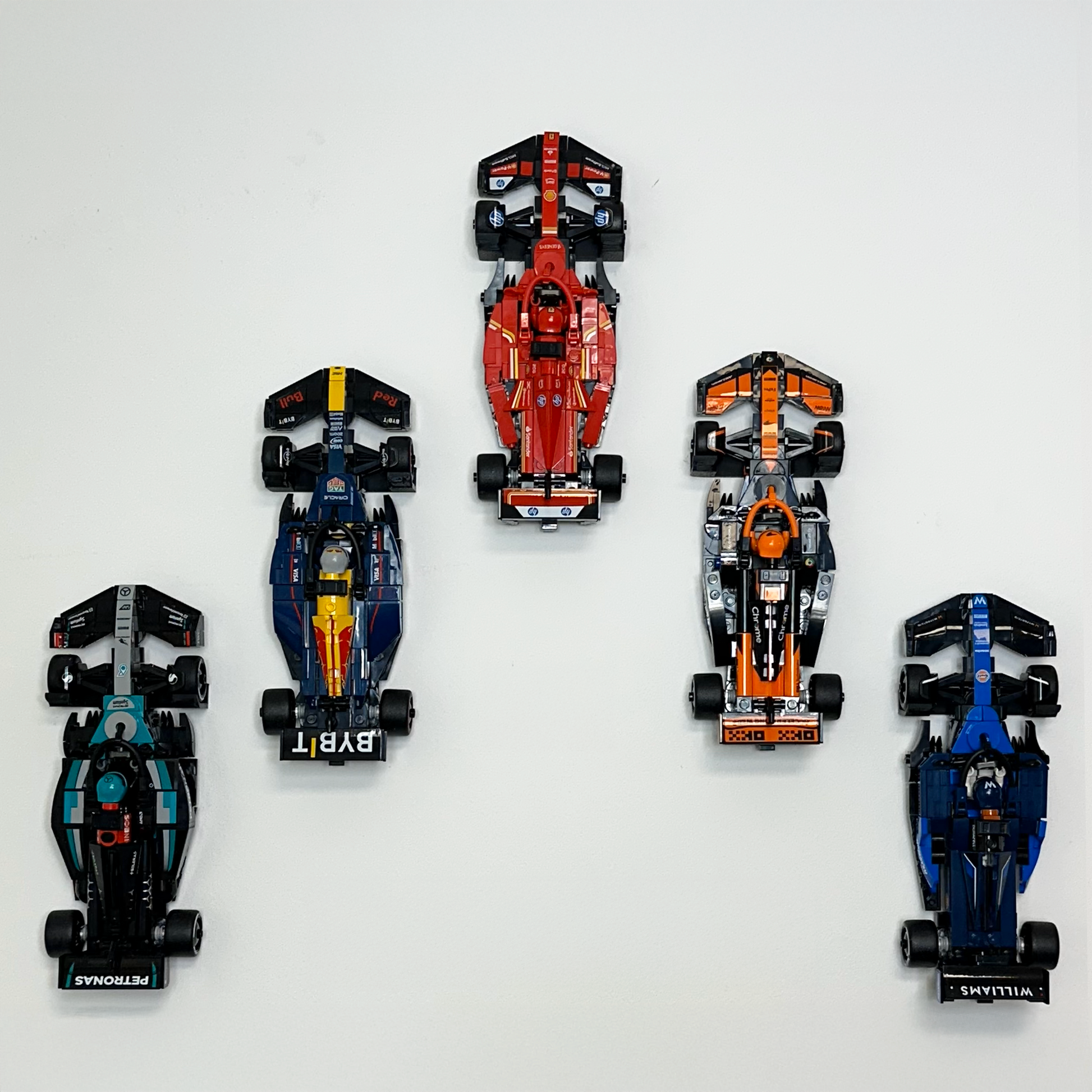 Speed Champions wall display rack showcasing LEGO F1 models