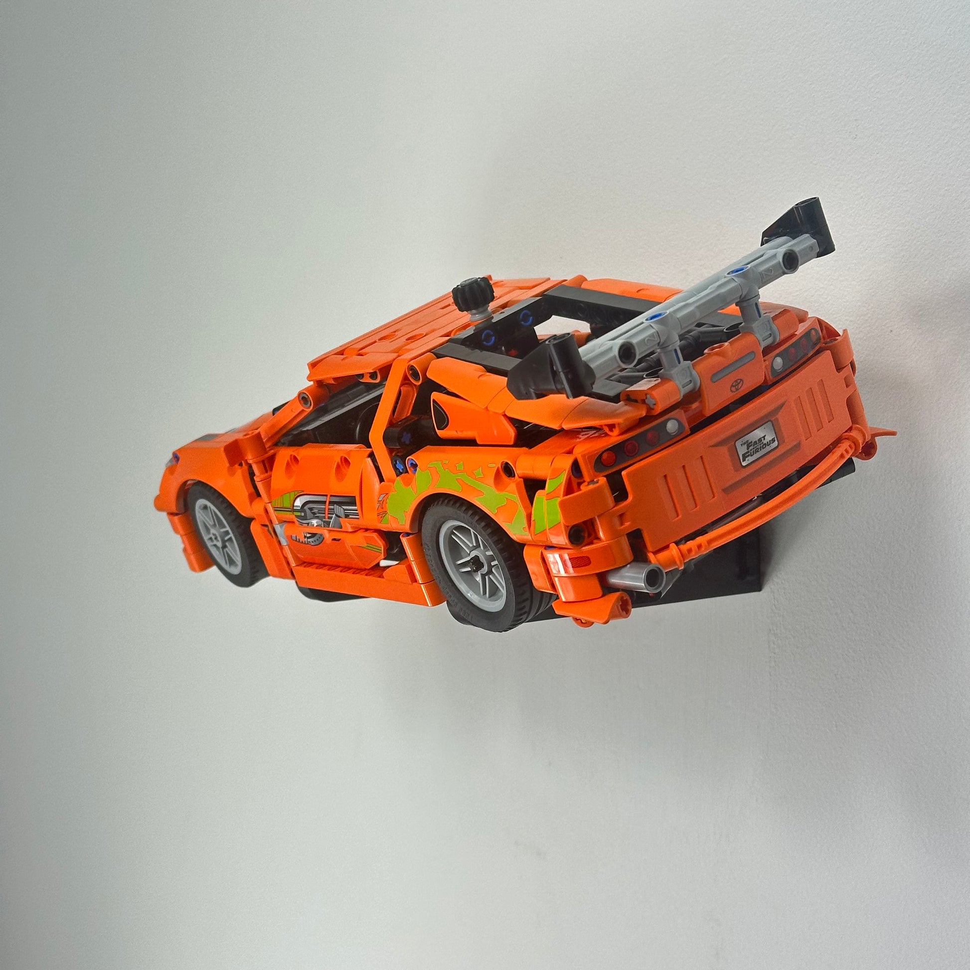 LEGO Toyota Supra MK4 42204 mounted at an angle on wall display bracket