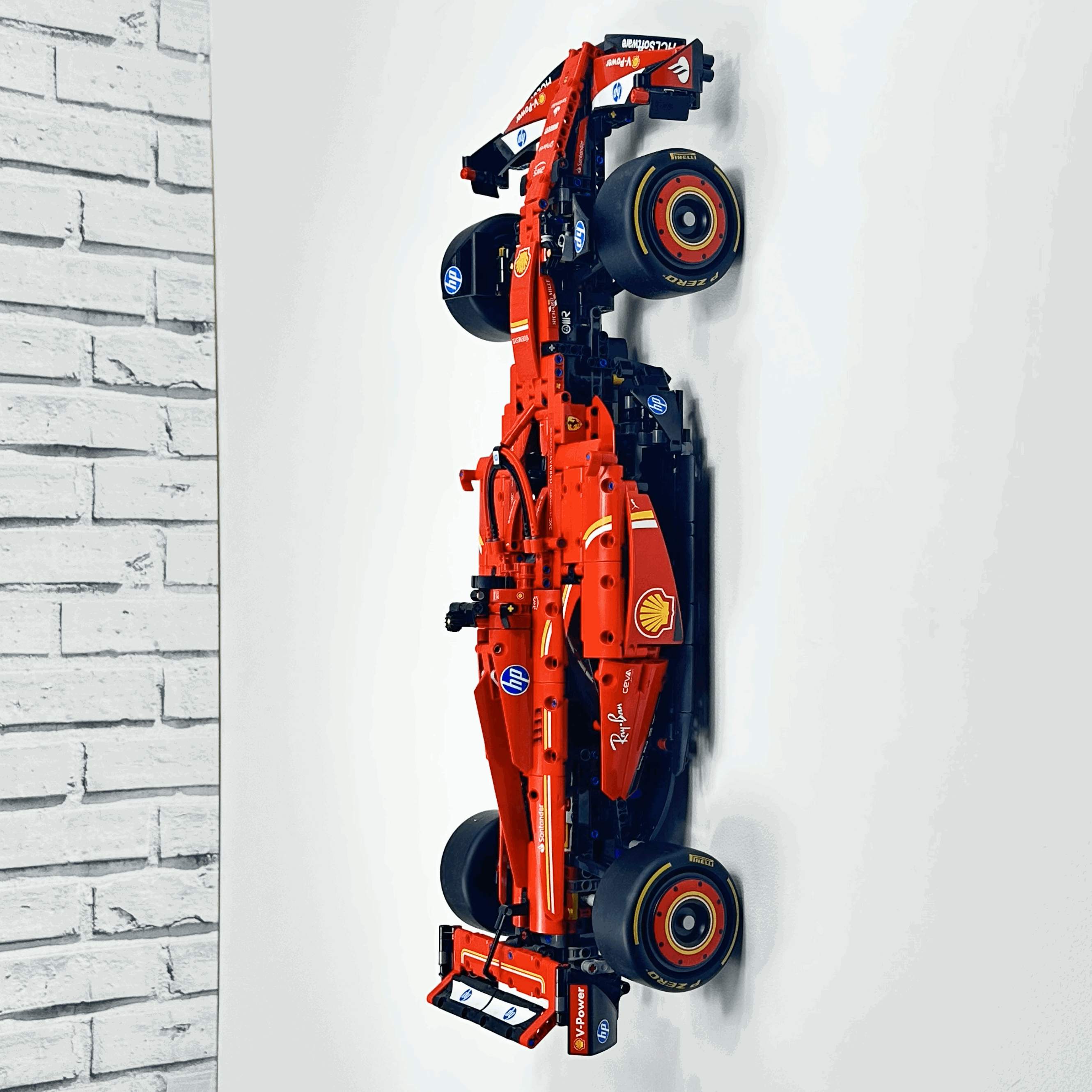 LEGO Ferrari SF-24 F1 Car 42207 displayed vertically on wall-mounted hook