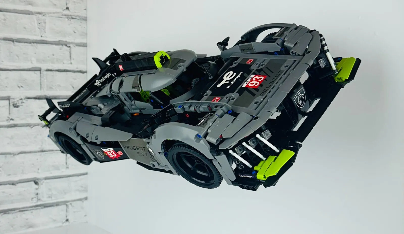 Wall mount display stand for lego Peugeot Le mans 9x8 42156 angled off wall home storage