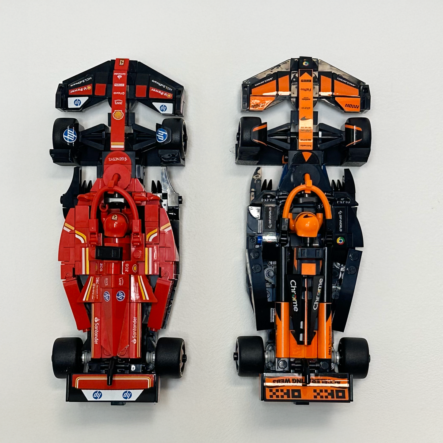 LEGO car mounted on a sleek, black 3D-printed wall display holder