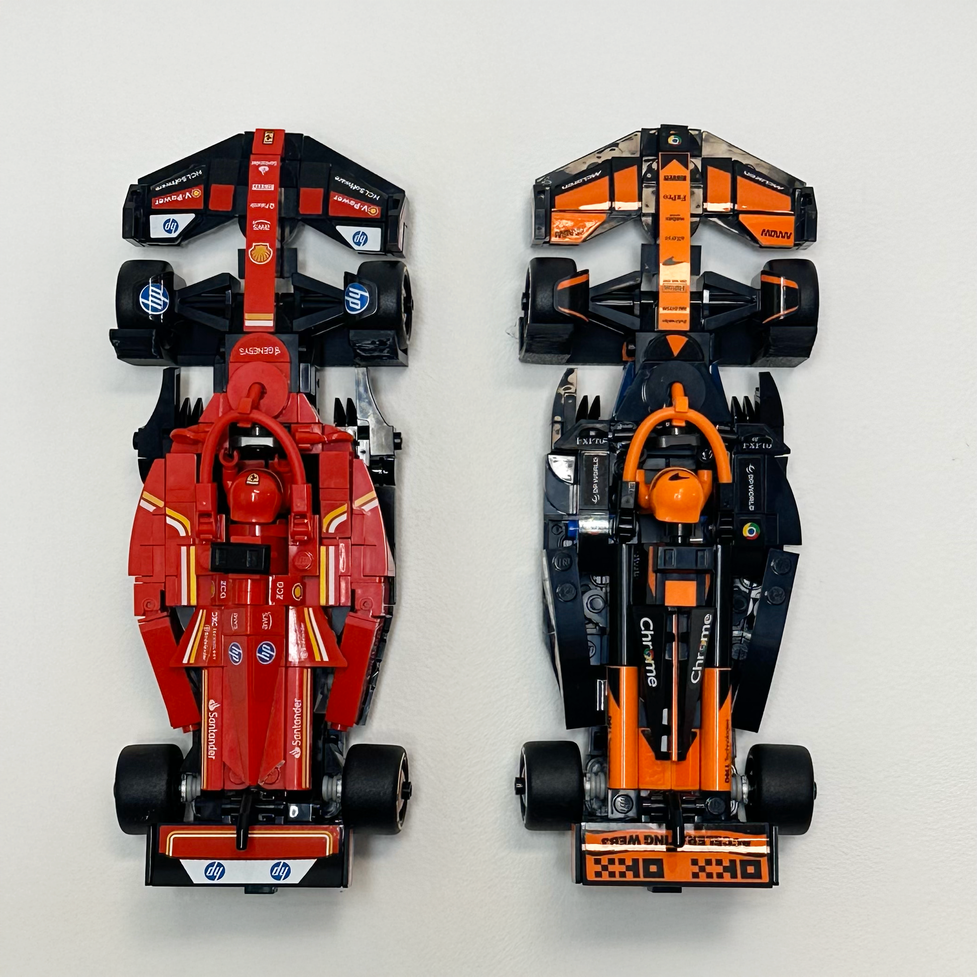 LEGO car mounted on a sleek, black 3D-printed wall display holder