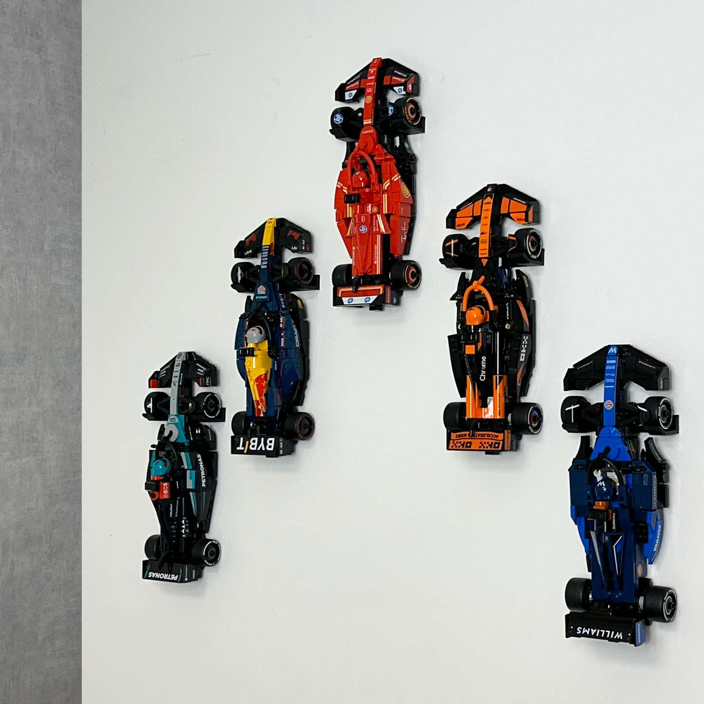 Wall-mounted LEGO Speed Champions display featuring Formula 1 cars