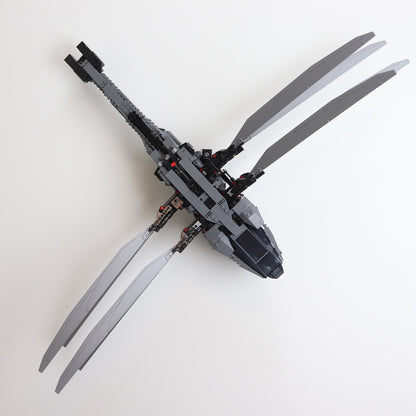 Vertical wall mount display stand holding LEGO® Dune Atreides Royal Ornithopter 10327 model, presenting the aircraft at a dynamic angle on the wall.
