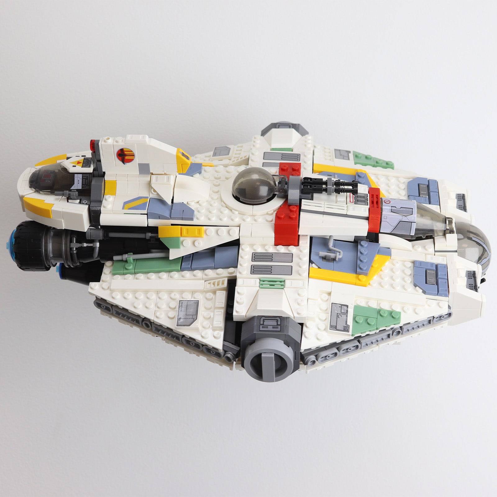 Wall mount display stand holding LEGO® Ghost & Phantom II (75357) models, showcasing the ships at an angled position on the wall for an impressive visual presentation.
