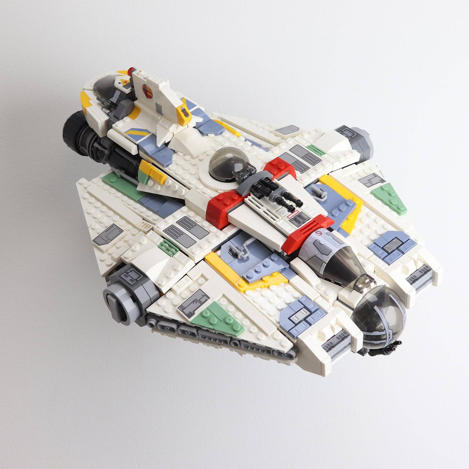 Wall mount display stand holding LEGO® Ghost & Phantom II (75357) models, showcasing the ships at an angled position on the wall for an impressive visual presentation.

