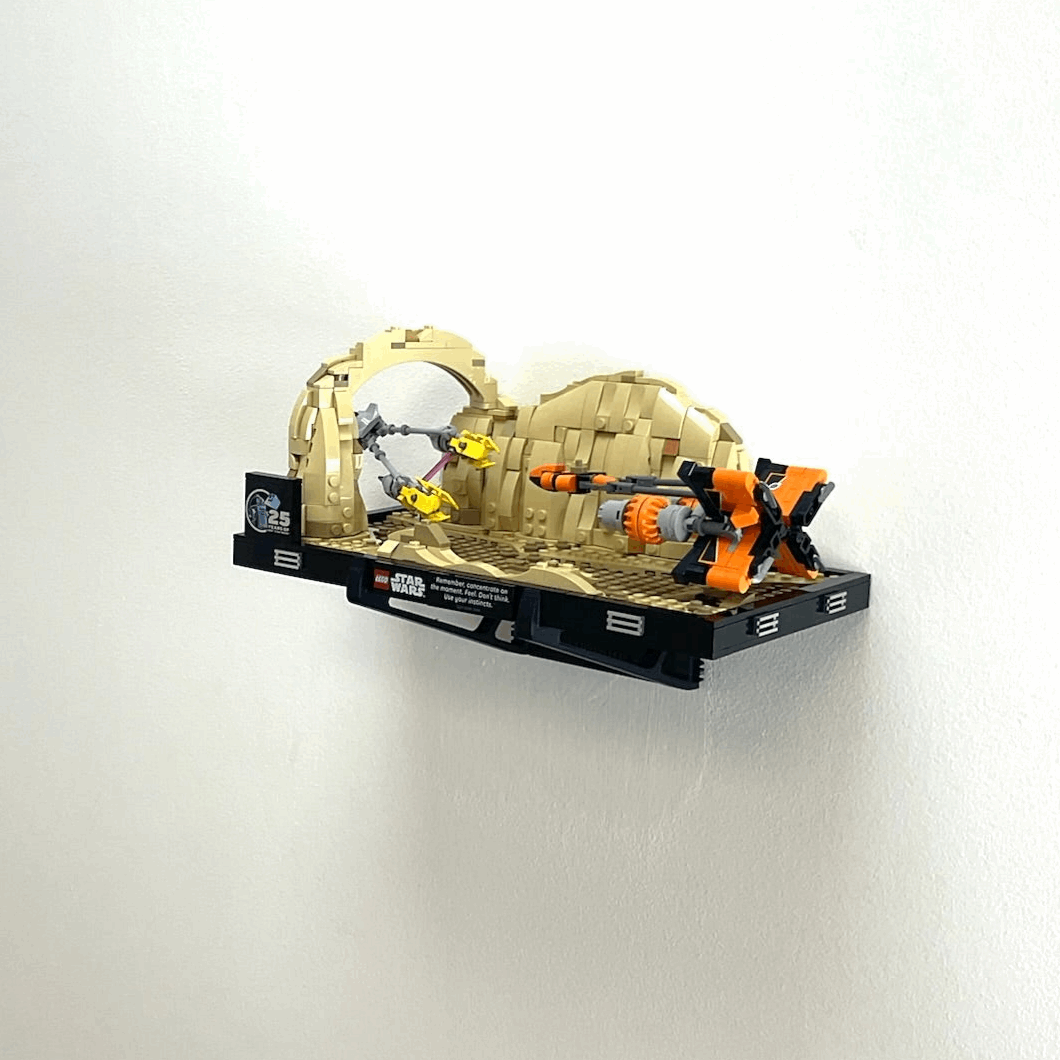 Wall mount display stand holding LEGO® Podrace Diorama (75380), showcasing the intricate scene at an angled position on the wall for an eye-catching display.
