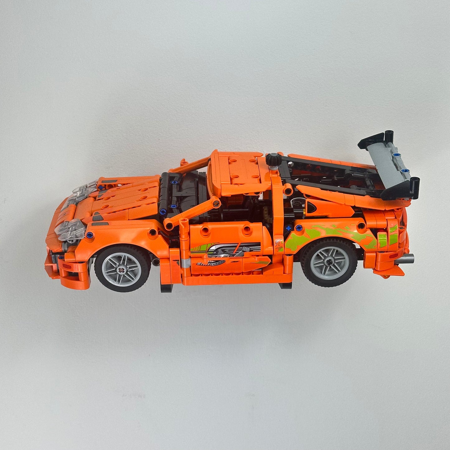 LEGO 42204 Toyota Supra MK4 secured on angled floating wall mount