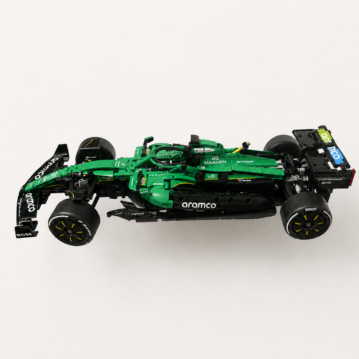 Angled view of LEGO Aston Martin AMR25 set 42240 mounted away from the wall using a model-specific BrickNest display bracket