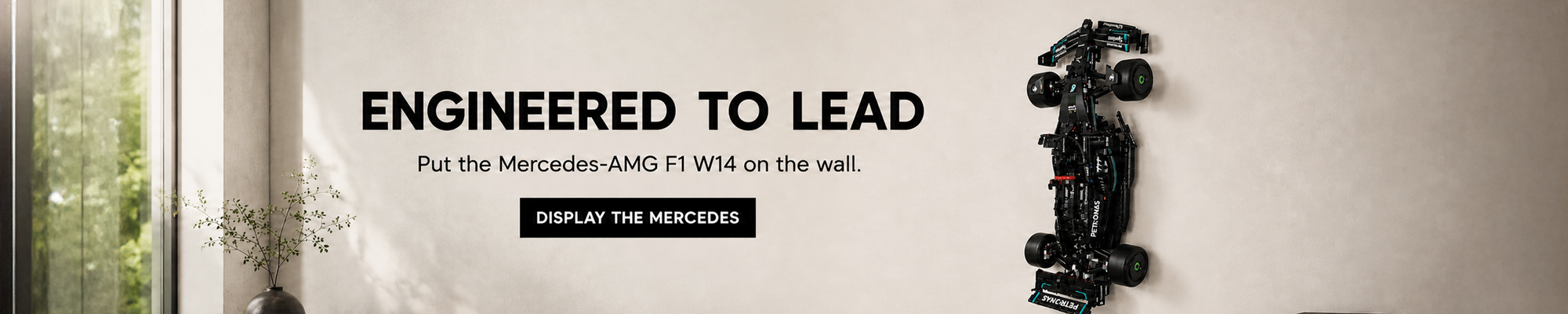 LEGO Mercedes Formula 1 car displayed securely on a BrickNest wall mount in a contemporary collector's room