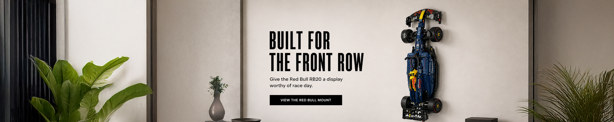LEGO Red Bull Racing Formula 1 car displayed on a BrickNest wall mount in a modern motorsport-themed room