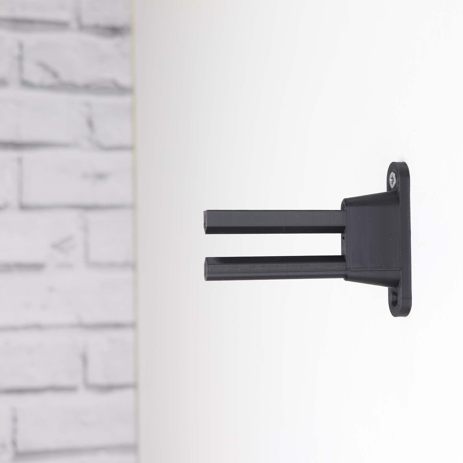 Wall display mount holding LEGO® Kawasaki Ninja Motorcycle (42170) model, displaying the motorcycle at an angled position on the wall for an attractive presentation.
