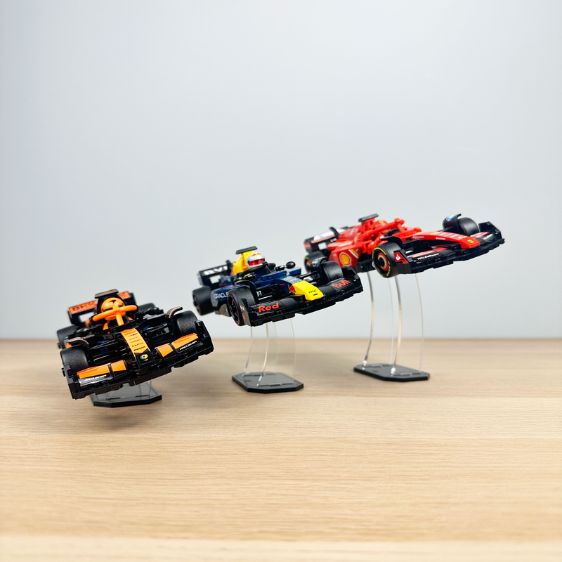 LEGO F1 Speed Champions models elevated on clear acrylic display risers