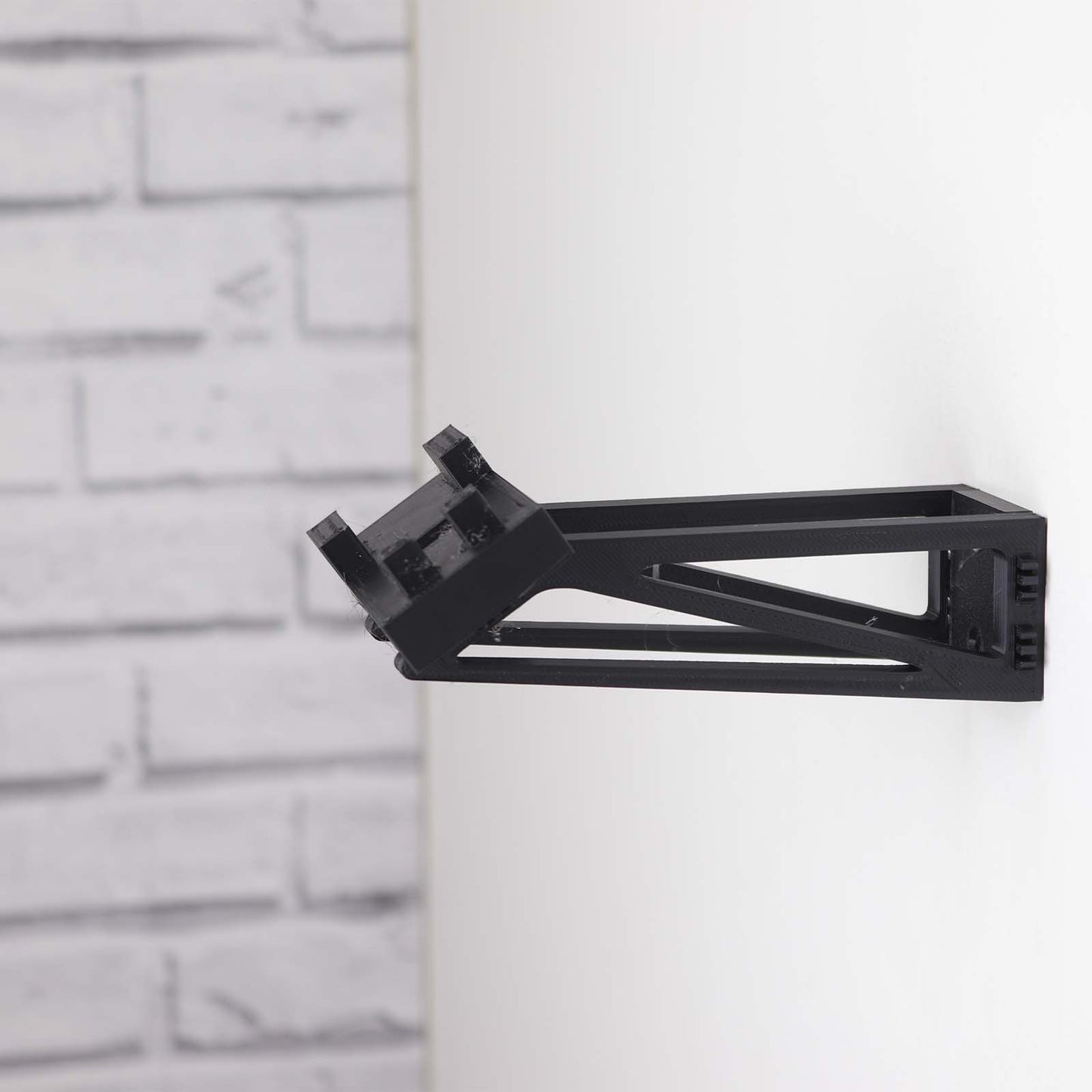 Wall mount display stand holding LEGO® Lamborghini Huracán models 42161 and 42196, presenting the cars at an angled position on the wall for a striking display.
