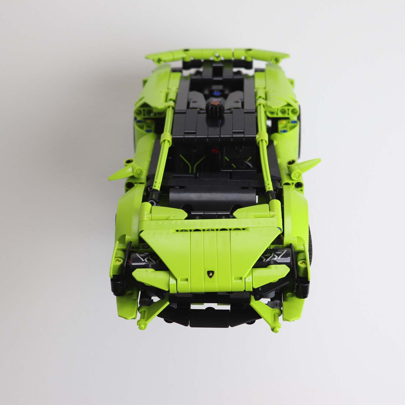 Wall mount display stand holding LEGO® Lamborghini Huracán models 42161 and 42196, presenting the cars at an angled position on the wall for a striking display.
