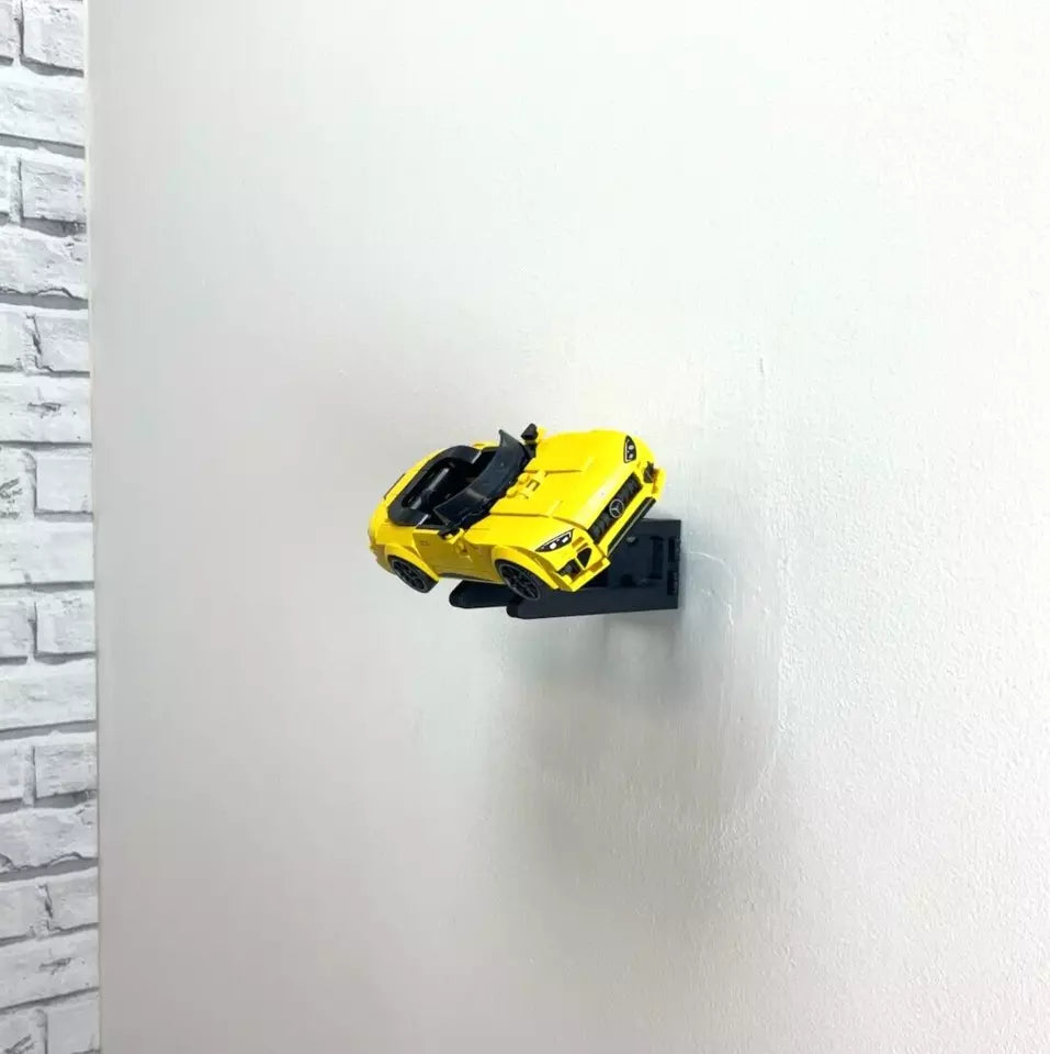 Wall mount display stand holding LEGO® Mercedes-AMG Speed Champion (76924) model, displaying the car at an angled position on the wall for a striking visual presentation.
