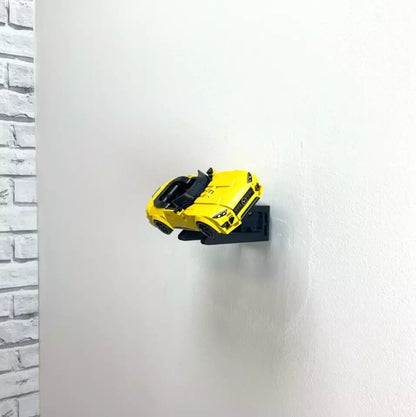 Wall mount display stand holding LEGO® Mercedes-AMG Speed Champion (76924) model, displaying the car at an angled position on the wall for a striking visual presentation.
