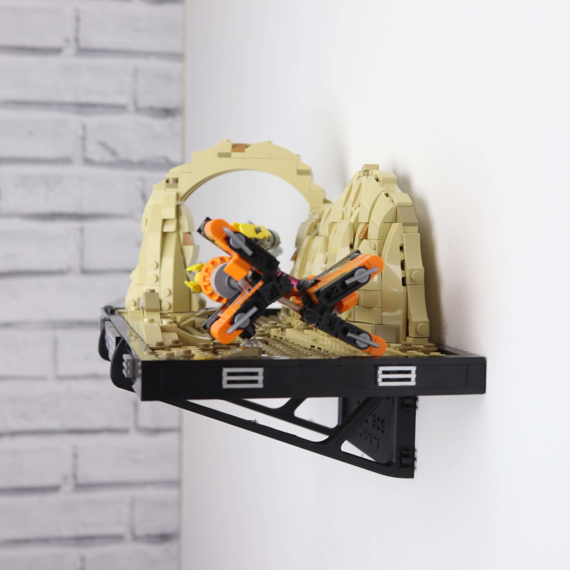 Wall mount display stand holding LEGO® Podrace Diorama (75380), showcasing the intricate scene at an angled position on the wall for an eye-catching display.
