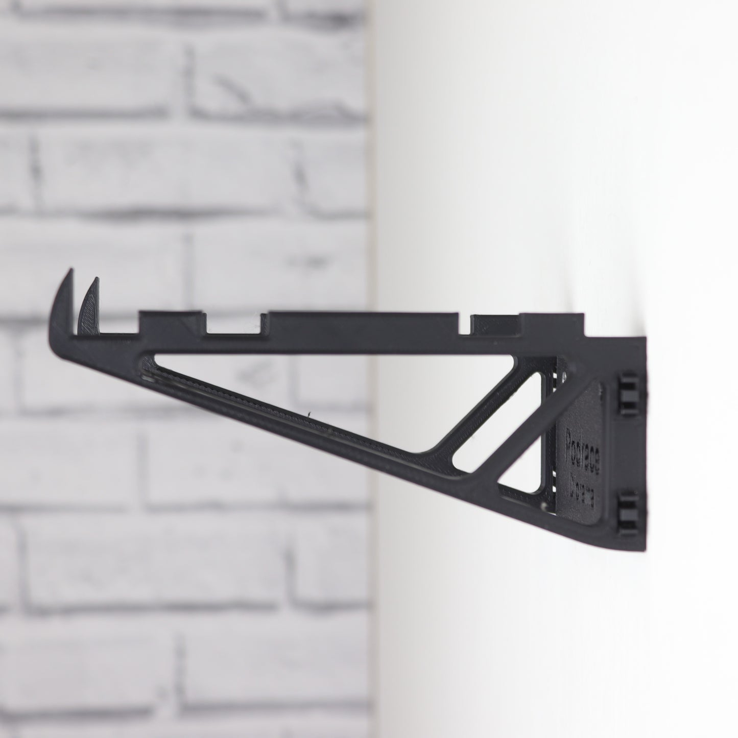 Wall mount display stand holding LEGO® Podrace Diorama (75380), showcasing the intricate scene at an angled position on the wall for an eye-catching display.
