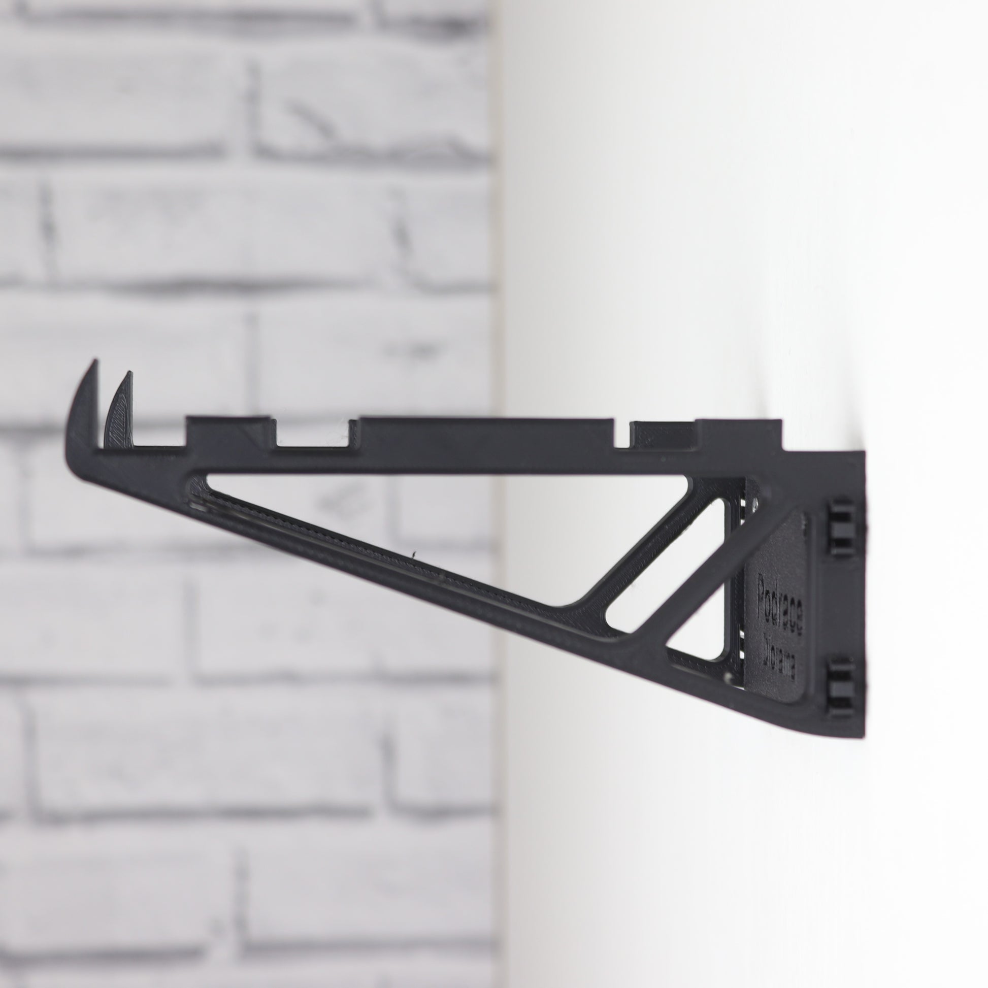 Wall mount display stand holding LEGO® Podrace Diorama (75380), showcasing the intricate scene at an angled position on the wall for an eye-catching display.
