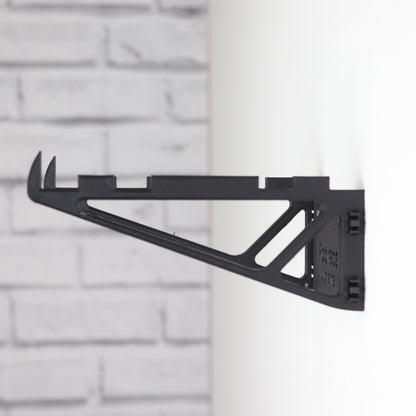 Wall mount display stand holding LEGO® Podrace Diorama (75380), showcasing the intricate scene at an angled position on the wall for an eye-catching display.
